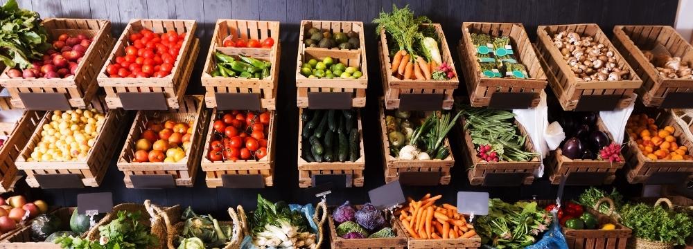 Variety of plant based foods filling crates in a market